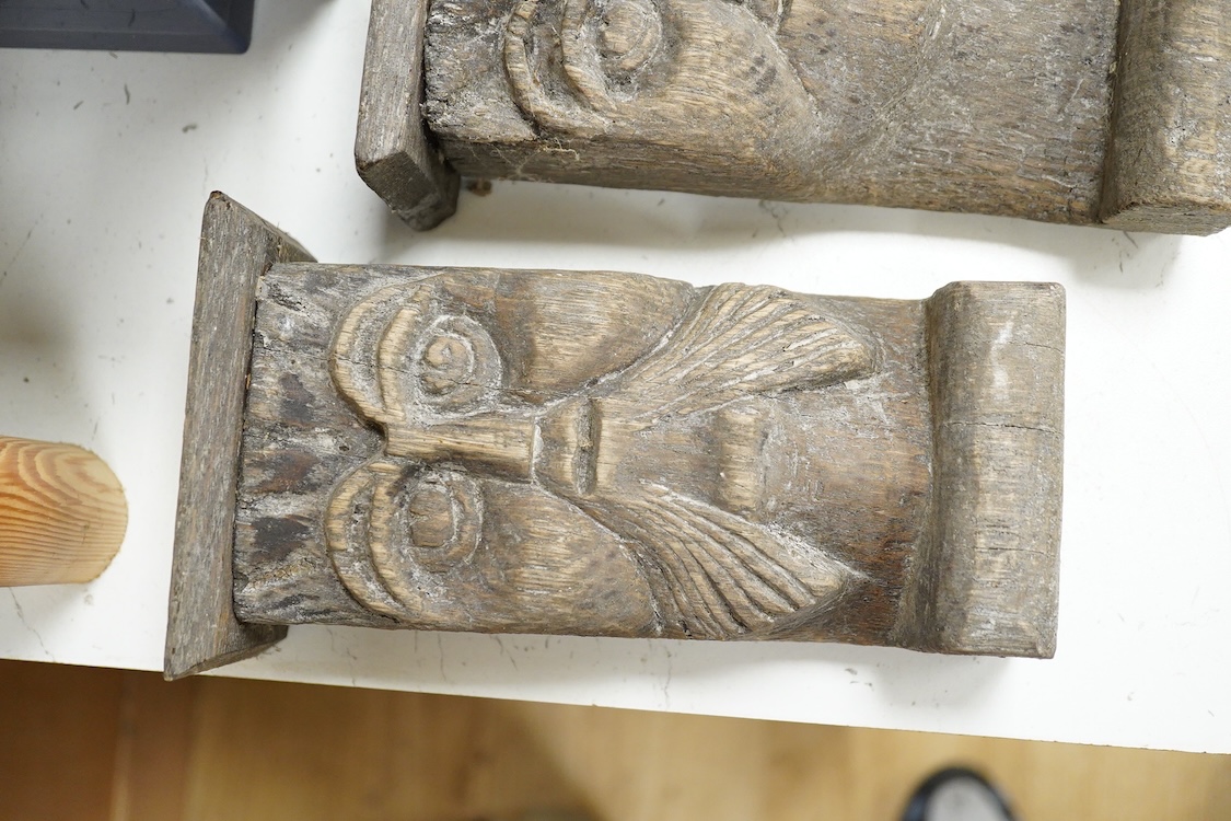 Two African carved wood ancestor figures, tallest 171cm, with two European carved mask capitals